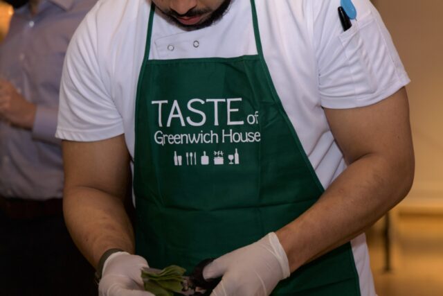 Chef serving in Taste of Greenwich House apron